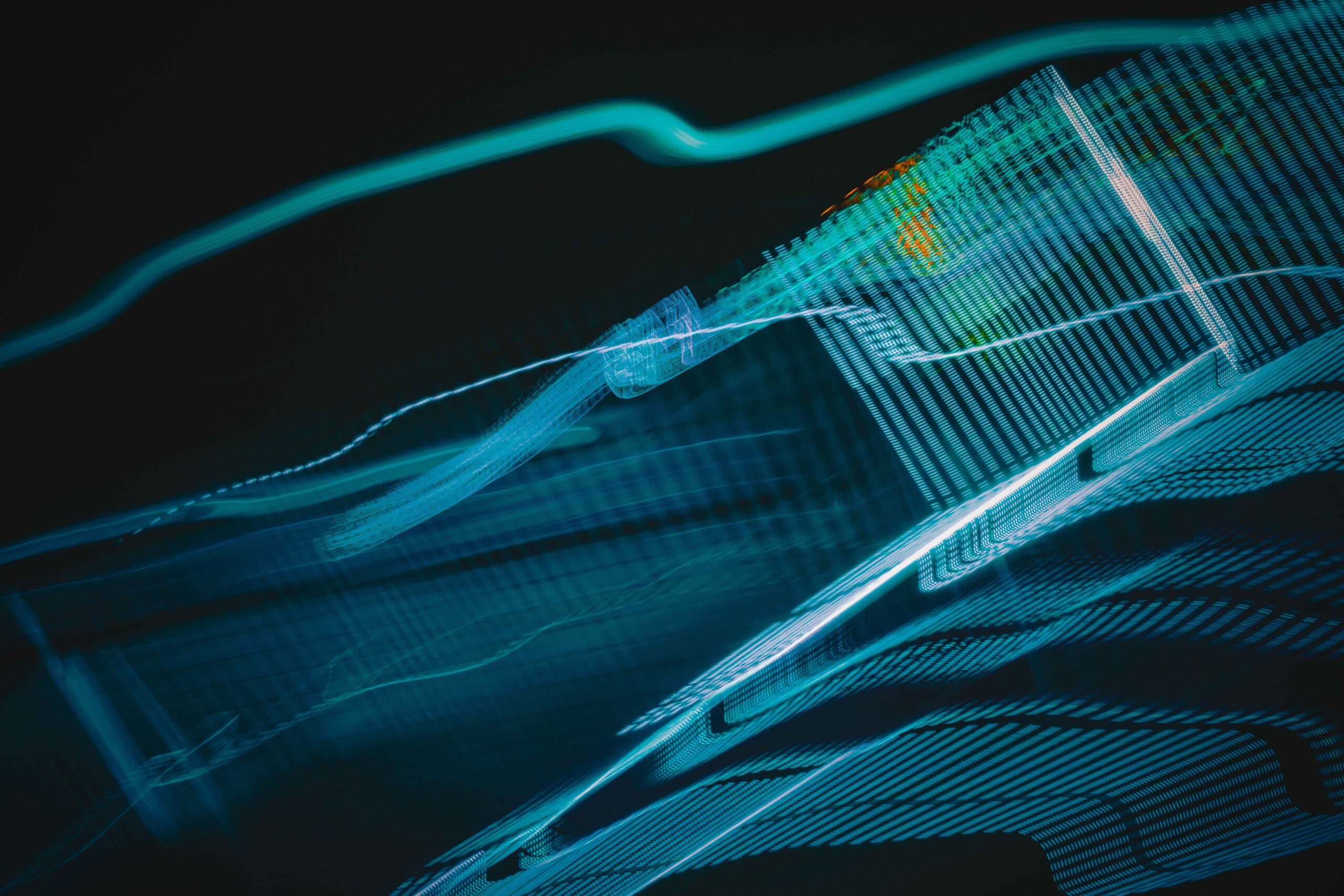Abstract digital artwork with blue light streaks on a dark background, creating a futuristic feel.